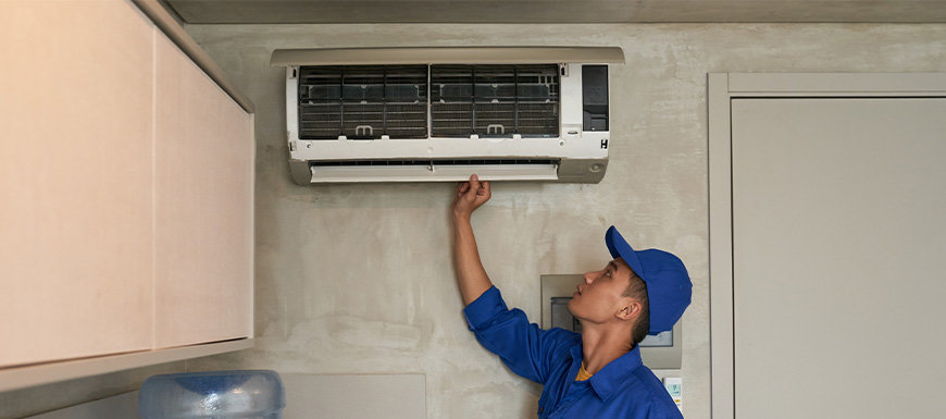 Technician checking hvac unit